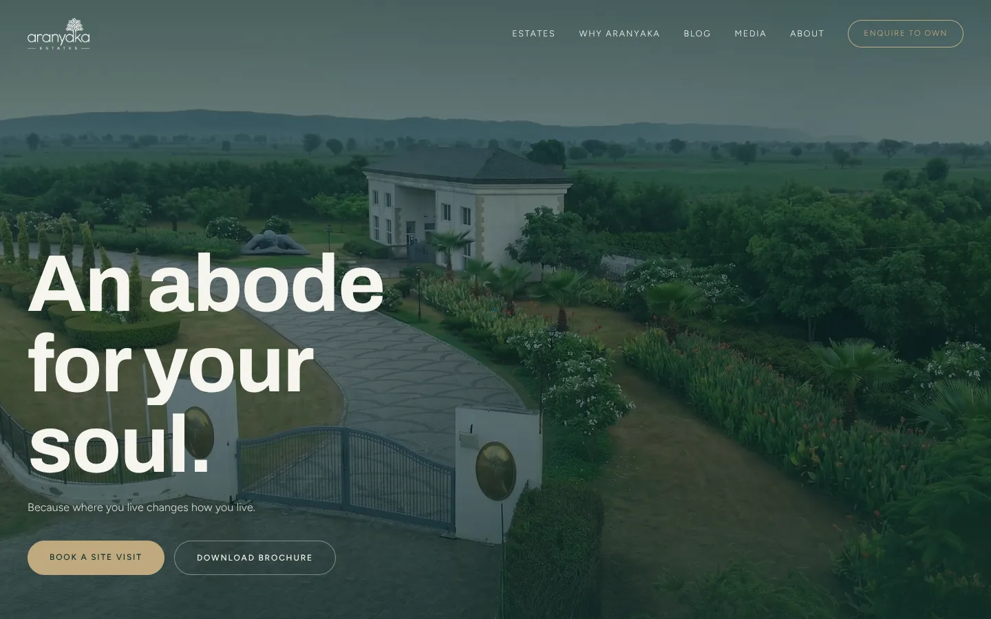 Aranyaka Estates website on a laptop